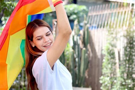 Happy Smiling Homosexual Lesbian Woman Holding Rainbow Flag Young