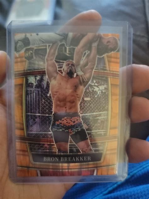 2022 Panini Select WWE Concourse Bron Breakker Orange Flash Prizm NXT