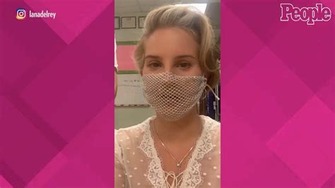 Lana Del Rey Receives Backlash For Wearing A Mesh Face Mask During Book