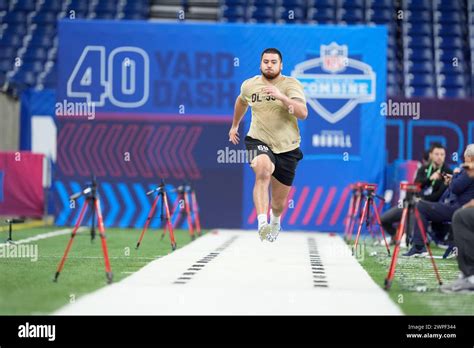 Kansas offensive lineman Dominick Puni runs a drill at the NFL football ...