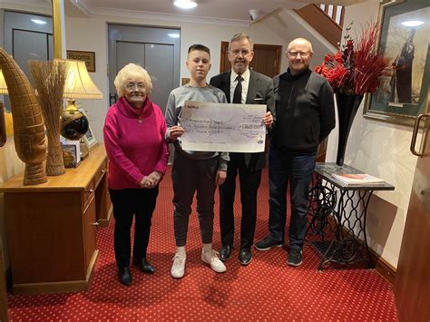 Lewis Dylan Thomas Cheque Presentation Ty Bryngwyn Hospice Ty