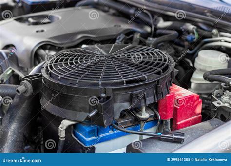 The Engine Cooling Fan is Prepared for Installation Under the Hood of a ...