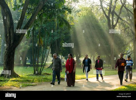 Dhaka residents take a morning walk in the wintry weather in the Ramna ...