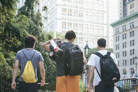 "Men Friends Hanging Out Together Walking Through Urban Park In Downtown New York's Financial ...