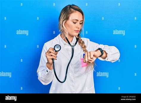 Beautiful Young Blonde Doctor Woman Holding Stethoscope Checking The