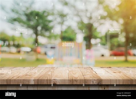 Empty Wooden Table Top And Abstract Blurred Light Bokeh And Blur