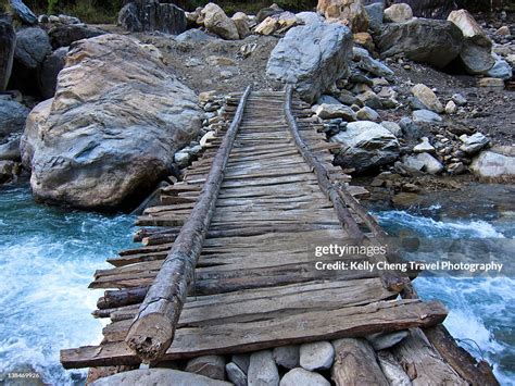 Wooden Bridge Over Mountain Stream High Res Stock Photo Getty Images