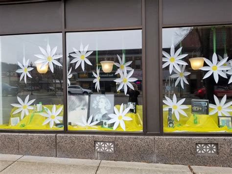 Fun paper daisy spring window display | Spring window display, Spring ...