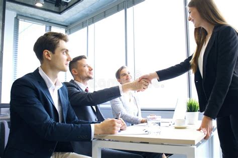 Job Applicant Having Interview Handshake While Job Interviewing Stock