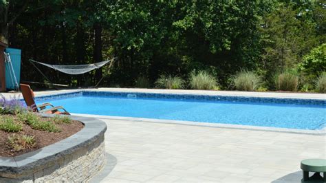 natural stone  greenery   welcoming poolside atmosphere landworx