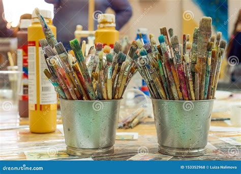 Set Of Paintbrushes Multi Colored On The Cup Paint Brushes And Paints