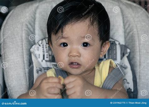 Adorable Joyful And Happy 1years Old Chinese Baby Boy Having Food While