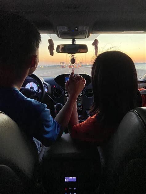 A Couple Holding Hands In The Car During A Sunset Couple Aesthetic