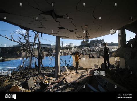 Gaza Th Mar People Stand Under The Structure Of A Destroyed