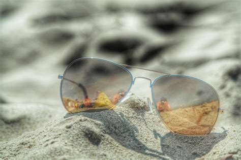 Premium Photo Close Up Of Sunglasses On Beach