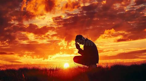 Silhouette of a Person Praying at Sunset Stock Photo - Image of ...