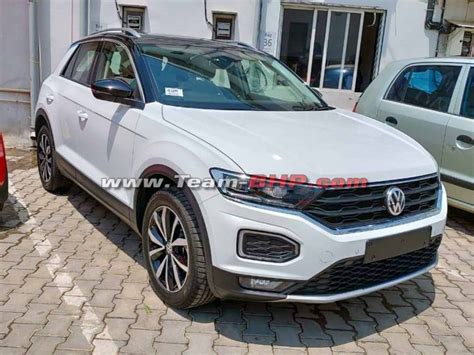 Volkswagen T-Roc SUV white colour, black roof arrives at dealer - Deliveries start