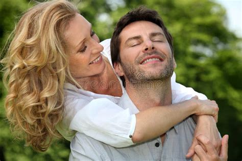 Playful couple in park stock image. Image of grass, picnic - 21370661