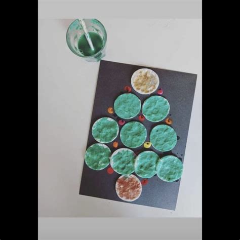 A Paper Plate With Some Food On It Next To A Plastic Cup And A Candle