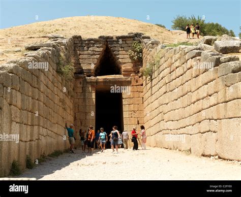 Mycenae Peloponnese Greece Tourists At The Entrance Of Tholos Tomb