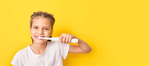 Premium Photo Beautiful Brown Haired Teenager Girl Brushing Teeth