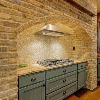 Country Style Stove Surround With Arched Brick Opening And Matte Blue