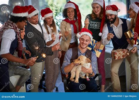 Workers Celebrating Christmas Together At Work Business People In