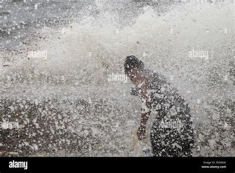 Manila Philippines 11th Aug 2018 A Wave Crashes On A Man Collecting