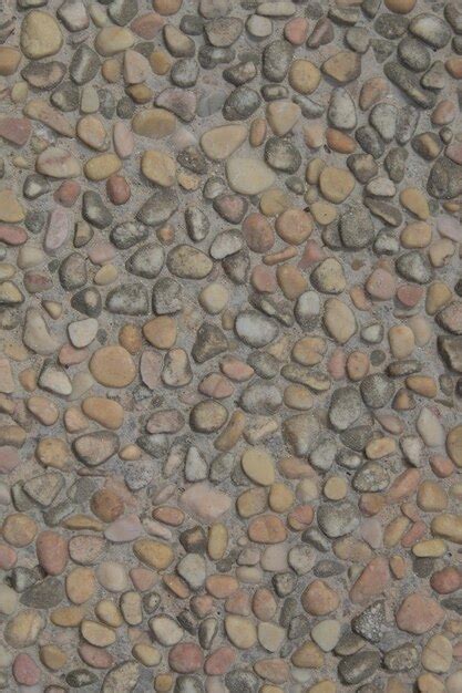 Premium Photo | A close up of a stone floor with a stone pattern.