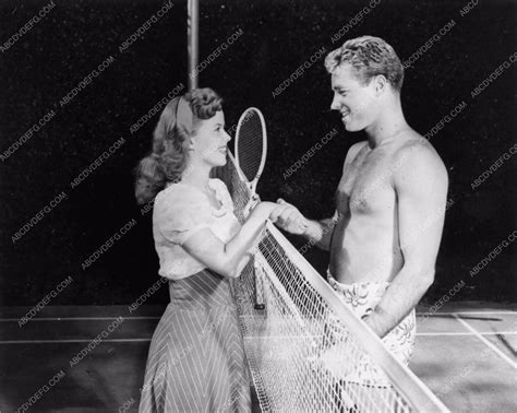 Candid Shirley Temple And Handsome Shirtless Guy Madison Playing Tennis