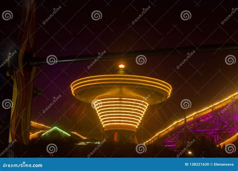 A Blurry Chain Carousel In Motion At The Amusement Park Night