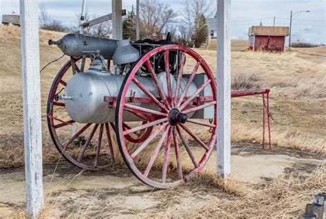 Premium Photo Antique Fire Fighting Equipment On A Wooden Carriage