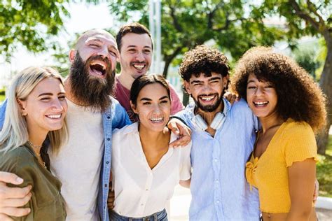 Portrait Group Of Happy Multiracial Young Friends Hugging Each Other