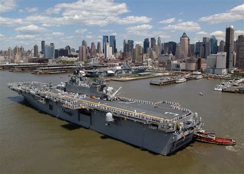 Aerial Port Side Stern View Showing US Navy USN Sailors Manning The