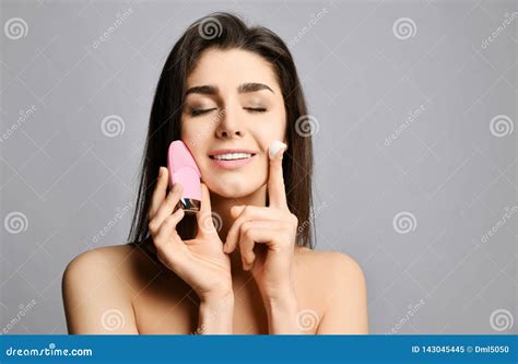 Pretty Woman Hold Pink Face Exfoliator Brush Silicone Cleansing Device ...