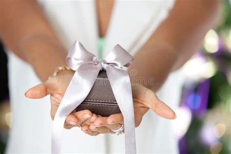 Shot Of Female Hands Holding A Small Gift Box Stock Photo Image Of