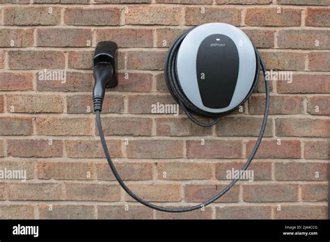 Home Charging Point Pod Point Domestic Electric Vehicle Charging Point Mounted On A Brick Wall