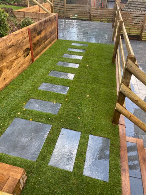 Raised Sleeper Walling With Decking And Paving Modern Deck