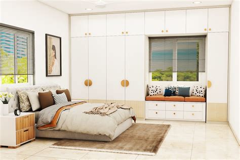 Guest Bedroom Design With Bay Window Seating And White Wardrobe | Livspace