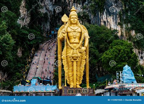 Huge Gold Statue Of Hindu God Hanuman At Entrance Of Batu Caves During