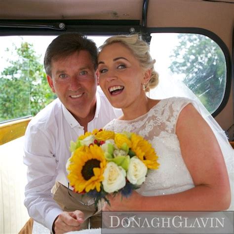 The Bride And Groom Are Posing In Their Wedding Car