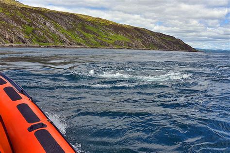 Current next to the boat at the Corryvreckan whirlpool, Isle of Jura ...