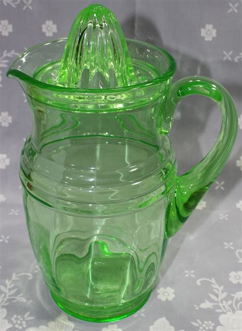 A Large Green Glass Jug Juicer With Lid By Us Glass Company Green