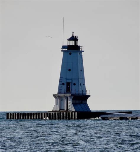 Premium Photo | The ludington lighthouse stands majestically on lake ...