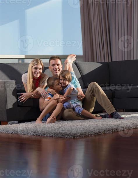 Family in livingroom 10707967 Stock Photo at Vecteezy