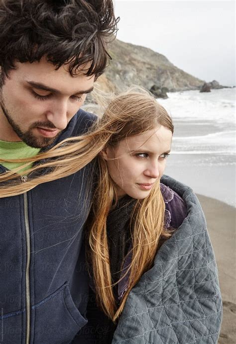 Young Couple Walking On The Beach In Nature By Stocksy Contributor