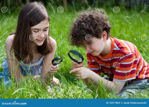 Kids Using Magnifying Glass Stock Image - Image: 10277863