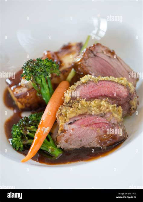 Roast Rump Of Herb Crusted Lamb Stock Photo Alamy