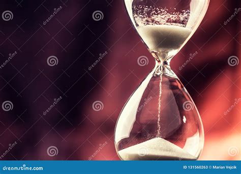 Modern Hourglass In Running Time On Wooden Table Stock Image Image Of