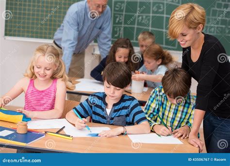 Two Teachers In Class With Their Young Students Stock Photo - Image: 43506767